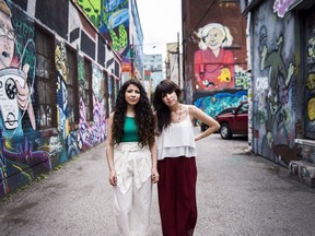 Toronto-based sisters and music duo behind the pop group 'LOLAA', Lex Valentine, right, and Nadia Valerie King pose for a photograph in Toronto on Wednesday, June 13, 2018.