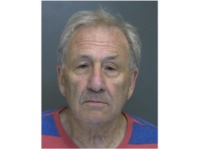 Astrof was charged Friday, July 6, 2018 with making a terroristic threat and reckless endangerment. The 75-year-old was jailed overnight pending a Saturday arraignment.  (Suffolk County Police Department via AP)