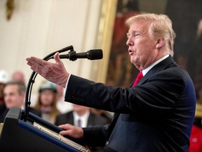 FILE - In this July 19, 2018 file photo, President Donald Trump speaks before signing an Executive Order that establishes a National Council for the American Worker during a ceremony in the East Room of the White House in Washington. Trump said he's willing to hit all imported goods from China with tariffs, sending U.S. markets sliding before the opening bell, Friday, July 20.  In a taped interview with the business channel CNBC, Trump said "I'm willing to go to 500," referring roughly to the $505.5 in goods imported last year from China.