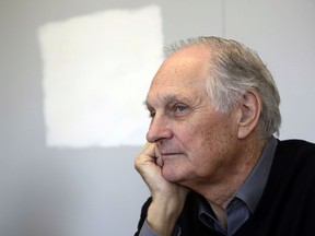 FILE - In this April 26, 2013 file photo, actor Alan Alda listens during an interview at Stony Brook University, on New York's Long Island.  Alda says he has Parkinson's disease. Appearing Tuesday, July 31, 2018,  on "CBS This Morning," the former "MASH" star said he was diagnosed with the neurodegenerative disorder three and a half years ago.