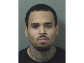 This booking photo provided by Balm Beach County Sheriff's Office shows Chris Brown.  The singer walked off stage after his concert in Florida and into the hands of waiting sheriff's deputies, who arrested him on a felony battery charge and booked him into the Palm Beach County Jail. A sheriff's spokeswoman said the entertainer was released after posting $2,000 bond on the battery charge issued by the sheriff's office in Hillsborough County. No details about the allegations in the arrest warrant were immediately available.  (Balm Beach County Sheriff's Office via AP)