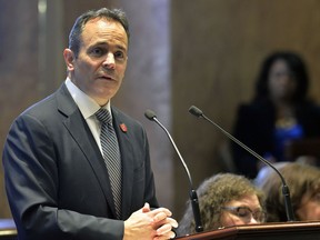 FILE - In this Tuesday, Jan. 16, 2018 file photo, Kentucky Gov. Matt Bevin speaks to a joint session of the General Assembly at the Capitol in Frankfort, Ky. A federal judge says Kentucky can't require poor people to get a job to keep their Medicaid benefits, chastising President Donald Trump's administration for rubber-stamping the new rules without considering how many people would lose their health coverage.
