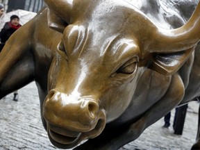 FILE - This Feb. 7, 2018 file photo shows The Charging Bull sculpture by Arturo Di Modica, in New York's Financial District.  Many along Wall Street expect the bull market rally that began in March 2009 to eclipse the 1990-2000 run that ended with the dot-com crash. But more voices are questioning whether the stock market's run will make it beyond 2019 or 2020.