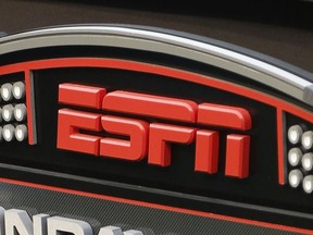 FILE - In this Sept. 16, 2013, file photo, an ESPN logo is seen prior to an NFL football game between the Cincinnati Bengals and the Pittsburgh Steelers in Cincinnati. The network will air the inaugural Overwatch League Grand Finals in prime time this month as part of a multiyear agreement to bring esports to the biggest sports platform on American television. Disney and Blizzard Entertainment announced plans Wednesday, July 11, 2018, to broadcast the OWL's playoffs and championship on ESPN, ABC and Disney XD. The Grand Finals on July 27 and 28 will be shown live on ESPN, marking the first time the network will carry esports in prime time.