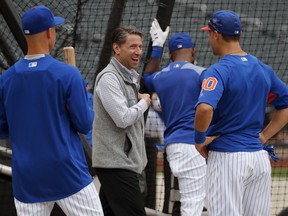 FILE - In this June 27, 2018, file photo, New York Mets chief operating officer Jeff Wilpon, center, talks with Michael Conforto and No. 1 draft pick Jerred Kelenic, left, before the team's baseball game against the Pittsburgh Pirates in New York. Wilpon won't need Jacob deGrom or Noah Syndergaard to bring a championship to New York this year. Though Wilpon is hardly a hardcore gamer, he and his family are showing a magic touch in the world of esports. The Wilpon-owned New York Excelsior have been a juggernaut during the inaugural season of the Overwatch League, and the Wilpons are being praised for their leadership of the video game club.