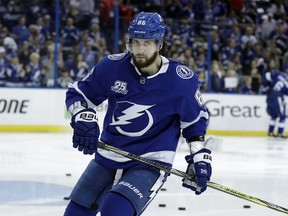 FILE - In this May 23, 2018, file photo, Tampa Bay Lightning right wing Nikita Kucherov warms up before Game 7 of the NHL Eastern Conference finals hockey playoff series against the Washington Capitals, in Tampa, Fla. The Lightning have signed forward Nikita Kucherov to an eight-year contract extension worth an average of $9.5 million in salary and annual bonuses. The team announced the deal Tuesday, July 10, 2018.
