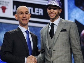 FILE - In this June 23, 2011, file photo, NBA Deputy Commissioner Adam Silver, left, poses with No. 35 overall draft pick, UCLA's Tyler Honeycutt, who was selected by the Sacramento Kings in the NBA basketball draft in Newark, N.J. A former coach and family friend says onetime Sacramento Kings and UCLA basketball player Tyler Honeycutt was found dead after a standoff with Los Angeles police.