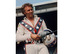 FILE - In this Aug. 20, 1974, file photo, Evel Knievel poses at the Canadian national exhibition stadium in Toronto. Fifty years after Evel Knievel so famously wiped out trying to jump the fountain at Caesar's Palace, action sports wild man Travis Pastrana will try to nail the stunt Sunday night, July 8, 2018, in the finale of a triple-header tribute to the late daredevil. (AP Photo/File)