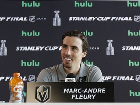 FILE - In this May 27, 2018, file photo, Vegas Golden Knights goaltender Marc-Andre Fleury speaks during an NHL hockey media day for the Stanley Cup, in Las Vegas. The Vegas Golden Knights have agreed to terms with three-time Stanley Cup champion goalie Marc-Andre Fleury on a three-year contract extension worth an average annual value of $7 million. The extension announced Friday, July 13, 2018, would keep him with Vegas through the 2021-22 season, creating the possibility that the 33-year-old Fleury could end his career with the Golden Knights.