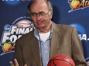 FILE - In this April 7, 2013, file photo, Associated Press college basketball writer Jim O'Connell gestures as he is honored by the NCAA and the Final Four coaches after a news conference at the NCAA Final Four college basketball tournament in Atlanta. O'Connell died Monday, July 2, 2018. He was 64.