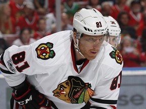 FILE - In this March 25, 2017, file photo, Chicago Blackhawks right wing Marian Hossa (81) prepares for a face off against the Florida Panthers during the first period of an NHL hockey game, in Sunrise, Fla. The Chicago Blackhawks have traded Marian Hossa and Vinnie Hinostroza Thursday, July 12, 2018, in a blockbuster deal with the Arizona Coyotes, parting with a promising young forward in order to clear out a troublesome contract.  The Blackhawks also sent defenseman Jordan Oesterle and a third-round pick in the 2019 draft to the Coyotes for forwards Marcus Kruger, MacKenzie Entwistle and Jordan Maletta, defenseman Andrew Campbell and a fifth-round pick in next year's draft.