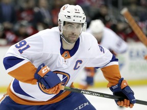FILE - In this Saturday, March 31, 2018 file photo, New York Islanders center John Tavares skates against the New Jersey Devils during the first period of an NHL hockey game, in Newark, N.J. The NHL's best rarely make it to free agency. Teams tend to re-sign their top players, keeping them off the market and on their rosters. That leaves a slew of solid veterans and journeymen available to the highest bidders trying to find a forward to play on a second or third line, a defenseman to be in a second pairing or perhaps a backup goaltender.