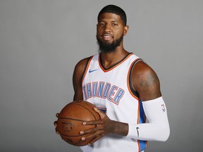 FILE - In this Sept. 25, 2017, file photo, Oklahoma City Thunder forward Paul George is pictured during an NBA basketball media day in Oklahoma City. George has decided not to exercise his $20.7 million option for next season with the Oklahoma City Thunder, a person with knowledge of the situation said Thursday. George will become an unrestricted free agent on Sunday. The person spoke to The Associated Press on condition of anonymity Thursday, June 28, 2018, because neither George nor the team has publicly announced his decision.