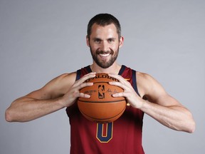 FILE - In this Sept. 25, 2017, file photo, Cleveland Cavaliers' Kevin Love poses for a portrait during the NBA basketball team media day, in Independence, Ohio. All-Star forward Kevin Love has signed a new four-year, $120 million contract with the Cleveland Cavaliers, who are beginning anew following LeBron James' departure. Love signed the extension Tuesday.