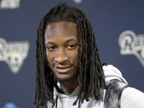 FILE - In this April 16, 2018, file photo, Los Angeles Rams running back Todd Gurley talks with reporters after off-season training at the NFL football team's practice facility in Thousand Oaks, Calif. Gurley has agreed to a lucrative contract extension with the Rams. Rams general manager Les Snead confirmed the new deal Tuesday, July 24, 2018, for the NFL's offensive player of the year. The Rams didn't announce the terms of the deal, but ESPN says it's a four-year extension worth $60 million through 2023.