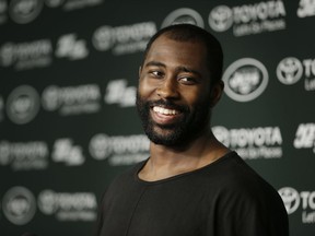 FILE - In this Aug. 11, 2015, file photo, New York Jets' Darrelle Revis speaks to the media after a Jets practice in Florham Park, N.J.  Revis, a star cornerback with the New York Jets and a Super Bowl winner with their archrivals, the Patriots, has retired. Revis announced Wednesday, July 18, 2018, on Twitter that he was ending an 11-season career that included four All-Pro selections.