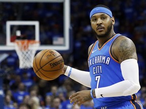 FILE - This is an April 25, 2018, file photo showing Oklahoma City Thunder forward Carmelo Anthony (7) during Game 5 of an NBA basketball first-round playoff series against the Utah Jazz, in Oklahoma City. Carmelo Anthony is done in Oklahoma City. A person with knowledge of the details tells The Associated Press the Thunder are sending the veteran NBA forward and a 2022 protected first-round pick to Atlanta in exchange for Hawks guard Dennis Schroder and Mike Muscala.