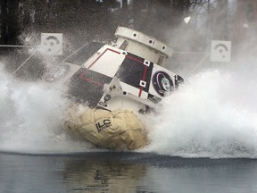 In this Feb. 9, 2016 photo made available by NASA, a mockup of Boeing's CST-100 Starliner spacecraft, in development in partnership with NASA's Commercial Crew Program, splashes into a 20-foot-deep basin at NASA's Langley Research Center in Hampton, Va., during testing of the spacecraft's landing systems design. On Wednesday, July 11, 2018, the U.S. Government Accountability Office said NASA needs a backup plan for getting astronauts to space, given additional delays on the horizon for new commercial crew capsules.