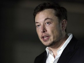 FILE - In a Thursday, June 14, 2018 file photo, Tesla CEO and founder of the Boring Company Elon Musk speaks at a news conference, in Chicago. Whether it's investors betting against his stock, reporters or analysts who ask tough questions or a union trying to organize his workers, Elon Musk has fought back, often around the clock on Twitter. But when Musk called a British diver involved in the Thailand cave rescue a pedophile to 22.3 million Twitter followers on July 15, he may have gone one tweet too far.