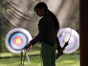 Ket Davis reaches for an arrow during an archery session at a Girl Scout day camp in Carnation, Wash., on Tuesday, June 26, 2018. As American women seek a larger role in politics, fairer wages and an end to sexual harassment, the Girl Scouts see an opportune time to show some swagger in promoting their core mission: girl empowerment.