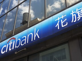 FILE- In this April 24, 2018, file photo, a Citibank sign is shown outside one of the bank's branch offices in New York. Citigroup reports earnings Friday, July 13, 2018.