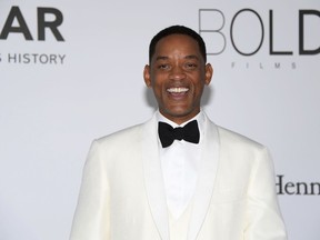 In this May 25, 2017 file photo, actor Will Smith poses for photographers upon arrival at the amfAR charity gala during the Cannes 70th international film festival, in Cap d'Antibes, southern France. Smith, Jordan Peele, Kirsten Dunst and Robert Downey Jr. are part of YouTube Original's new series line-up. YouTube said Friday, July 27, 2018,  that in "Will Smith: The Jump," the star will bungee jump from a helicopter over the Grand Canyon.