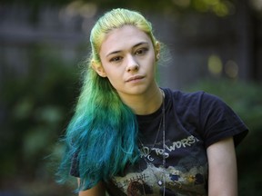 In this Sunday, June 26, 2016 photo Nicole Maines poses at her home in Portland, Maine. Maines, a transgender activist who won a discrimination lawsuit after her school refused to let her use the girls' bathroom will be TV's first transgender superhero. Maines will star in The CW/Warner Bros.' "Supergirl" as Nia Nal, aka Dreamer. Producers describe her character as a "soulful young transgender woman with a fierce drive to protect others."