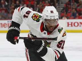 FILE - In this Jan. 25, 2018, file photo, Chicago Blackhawks left wing Anthony Duclair (91) plays against the Detroit Red Wings in the first period of an NHL hockey game in Detroit. The Columbus Blue Jackets signed Duclair to a $650,000, one-year contract the NHL veteran minimum, general manager Jarmo Kelakainen announced Friday, July 6, 2018. Duclair remains unfilled potential at 22 after being traded twice and not tendered a qualifying offer as a restricted free agent.