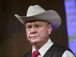 In this Sept. 25, 2017 file photo, former Alabama Chief Justice and U.S. Senate candidate Roy Moore speaks at a rally in Fairhope, Ala. The defeated Senate candidate is talking about a defamation suit after discovering that he too was duped by actor Sacha Baron Cohen. He says he didn't know Cohen would mock Israel and scheme to humiliate him and other conservatives such as Sarah Palin and Dick Cheney.
