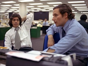 FILE - In this May 7, 1973 file photo, reporters Bob Woodward, right, and Carl Bernstein, whose reporting of the Watergate case won them a Pulitzer Prize, sit in the newsroom of the Washington Post in Washington. More than 40 years after they became the world's most famous journalism duo, Bob Woodward and Carl Bernstein are still making news. Bernstein was among three CNN reporters who last week broke the story of former Donald Trump lawyer Michael Cohen's allegation that Trump had advance knowledge of the June 2016 meeting between representatives of his campaign and Russian officials. On Tuesday, July 31, 2018, Woodward's upcoming "Fear: Inside the Trump White House" was No. 1 on Amazon.com. (AP Photo, File)