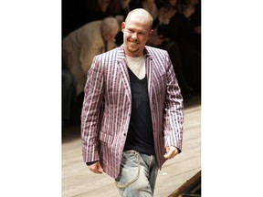 FILE - In this March 3, 2006 file photo, British fashion designer Alexander McQueen acknowledges applause after the presentation of his ready-to-wear fall/winter 2006-2007 fashion collection in Paris. A new documentary "McQueen" focuses on the late designer, who killed himself in 2010.