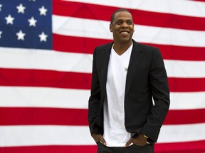 FILE - In this May 14, 2012 file photo, entertainer Jay-Z smiles after a news conference at Philadelphia Museum of Art in Philadelphia.  The rapper says he's disappointed his "Made in America" festival will not be held in Philadelphia after this year. The Philadelphia Inquirer reports the city confirmed Tuesday, July 17, 2018, that the annual concert won't be on the Benjamin Franklin Parkway anymore.