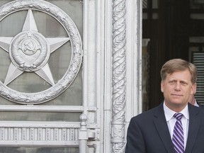 FILE - In this May 15, 2013 file photo, U.S. Ambassador to Russia Michael McFaul leaves the Foreign Ministry in Moscow, Russia. A memoir by the former U.S. ambassador, whom Russian officials have said they want to interview, is in the top 10 on Amazon.com. McFaul's "From Cold War to Hot Peace: An American Ambassador in Putin's Russia" was No. 6 as of midday Thursday. The book was published in May.