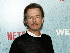 FILE - In this April 23, 2018 file photo, David Spade attends the premiere of Netflix's "The Week Of" in New York. Spade says his family is coming together after the death of his sister-in-law Kate Spade. The fashion designer killed herself in June.