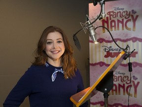 This March 2, 2018 photo released by Disney Junior shows Alyson Hannigan, who voices the character Claire Clancey for the animated series "Fancy Nancy," at a recording session in Los Angeles.