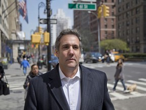 FILE - In this April 11, 2018, file photo, attorney Michael Cohen walks down the sidewalk in New York. Cohen, President Donald Trump's longtime personal lawyer who is under investigation by federal prosecutors in New York, said in his Twitter post Sunday, July 1, that he sat down for an interview with ABC News and his "silence is broken."