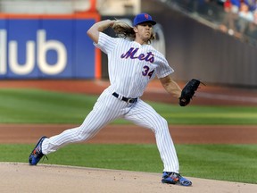 New York Mets starting pitcher Noah Syndergaard (34) delivers against the Washington Nationals during the first inning of a baseball game, Friday, July 13, 2018, in New York.