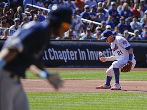 New York Mets third baseman Todd Frazier (21) cannot handle a ground ball hit by Tampa Bay Rays Kevin Kiermaier during the first inning of a baseball game, Saturday, July 7, 2018, in New York. Kiermaier was safe at first.
