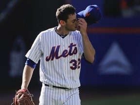 New York Mets starting pitcher Steven Matz (32) walks off the field at the end of the top of the fourth inning of a baseball game against the Tampa Bay Rays, Saturday, July 7, 2018, in New York.