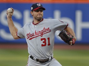 Washington Nationals starting pitcher Max Scherzer delivers against the New York Mets during the first inning of a baseball game Thursday, July 12, 2018, in New York.