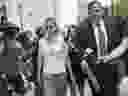 Clare Bronfman, center, arrives at federal court, Wednesday, July 25, 2018, in the Brooklyn borough of New York. 