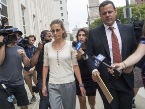 Clare Bronfman, center, arrives at federal court, Wednesday, July 25, 2018, in the Brooklyn borough of New York.