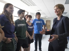 Democratic candidate for governor Cynthia Nixon talks to campaign volunteers at her campaign headquarters in the Brooklyn borough of New York, Thursday, July 12, 2018.