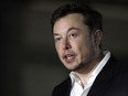 In this Thursday, June 14, 2018 file photo, Tesla CEO and founder of the Boring Company Elon Musk speaks at a news conference, in Chicago. On Tuesday, July 19, 2018, The Associated Press has found that stories circulating on the internet that Musk announced plans to leave Tesla to start a digital currency company are untrue.