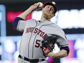 FILE - This April 9, 2018, file photo shows Houston Astros pitcher Ken Giles (53) throwing in the ninth inning of a baseball game against the Minnesota Twins in Minneapolis. The Astros traded Giles to the Toronto Blue Jays along with a pair of pitching prospects for Roberto Osuna. Houston also sent right-handers David Paulino and Hector Perez to Toronto as part of the deal, struck a day before the deadline for trades without waivers. The 23-year-old Osuna is eligible to pitch in the major leagues starting Sunday after a 75-game suspension under Major League Baseball's domestic violence policy.