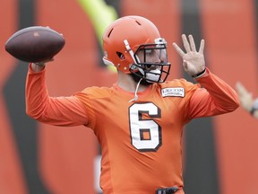 This June 12, 2018 photo shows Cleveland Browns quarterback Baker Mayfield throwing during practice at the NFL football team's training camp facility in Berea, Ohio. The Browns have signed Mayfield to his rookie contract. The Heisman Trophy winner from Oklahoma signed Tuesday, July 24, 2018 a day before Cleveland's players are due to report to training camp. Mayfield is not expected to start in his first season as the Browns intend to play Tyrod Taylor, who led Buffalo to the playoffs last season.