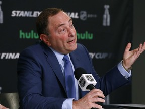 FILE - In this May 28, 2018 file photo NHL Commissioner Gary Bettman speaks during a news conference prior to Game 1 of the NHL Stanley Cup Final hockey game between the Vegas Golden Knights and the Washington Capitals in Las Vegas. Bettman says the league wants a cut of gambling profits if its intellectual property, data or video from games are used. Bettman tells guest host Larry Lage in the in the latest episode of "PodcastOne Sports Now"  on Tuesday, July 31, 2018 those who want to conduct gambling business with NHL assets will need to negotiate.