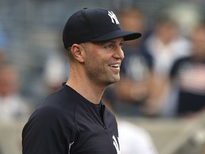 New York Yankees' J.A. Happ looks on from the dugout before a baseball game against the Kansas City Royals, Saturday, July 28, 2018, at Yankee Stadium in New York.