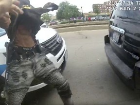 This frame grab from police body cam video provided by the Chicago Police Department shows authorities trying to apprehend a suspect who appeared to be armed, Saturday, July 14, 2018, in Chicago. The suspect was fatally shot by police during the confrontation. (Chicago Police Department via AP)