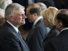 In a Wednesday, Feb. 28, 2018 file photo, Franklin Graham, the son of the Rev. Billy Graham, greets guests as Rev. Graham lies in honor after a ceremony in the Capitol, in Washington. Graham has flipped an anti-Donald Trump slogan into a T-shirt that urges his followers to pray for the 45th president. The Rev. Franklin Graham says on Facebook he was inspired to sell the "PRAY FOR 45" shirts after seeing news coverage of shirts with the slogan "IMPEACH 45." Echoing Trump's signature campaign motto, Graham writes: "Prayer can make America great!"